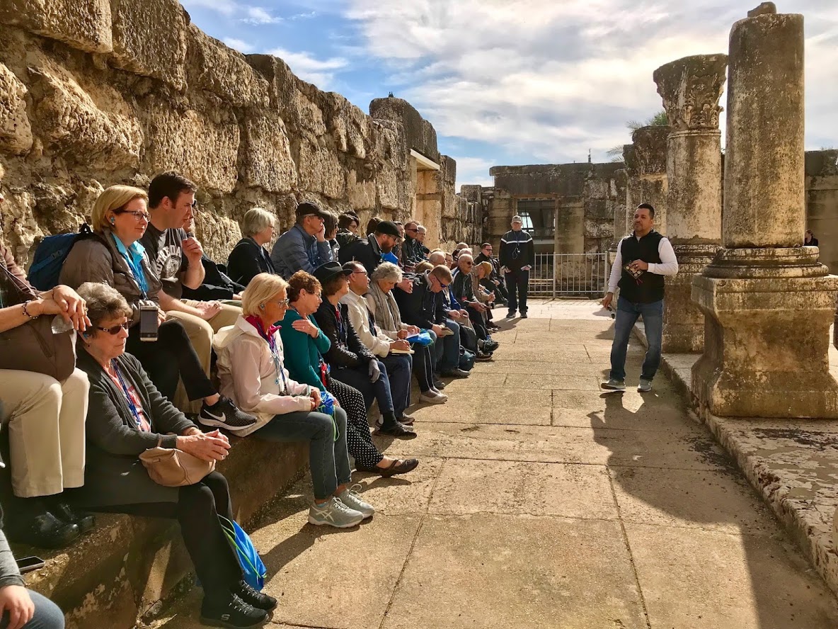 Hector Molina teaching at Capernaum White Synagogue with Select International Tours and Cruises